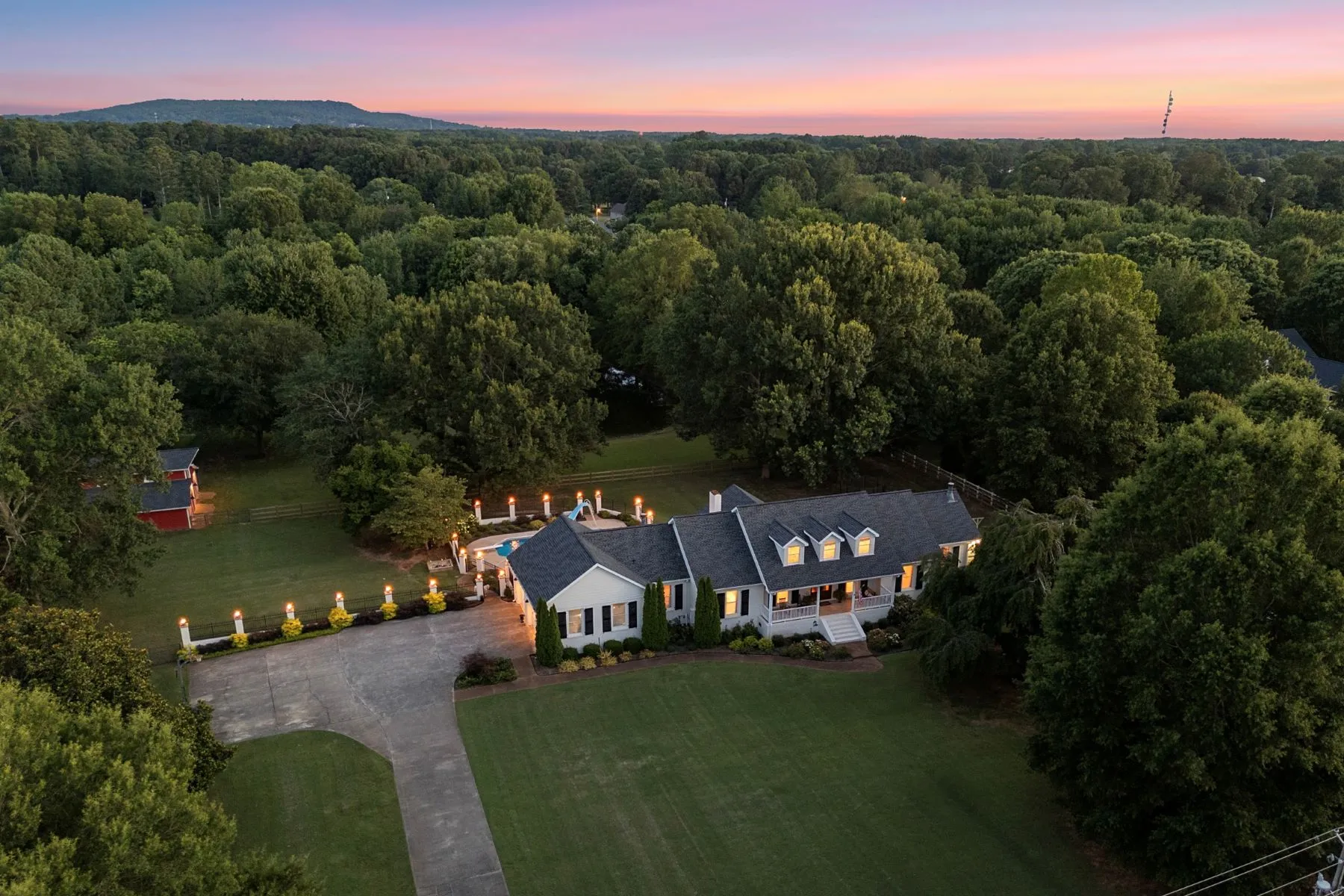 Aerial view of a beautiful property at sunset
